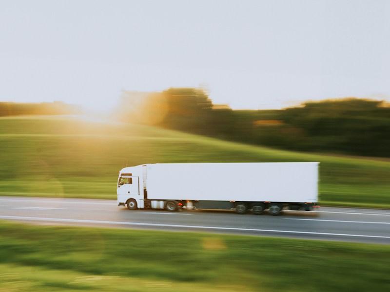 Truck driving on a highway through the countryside